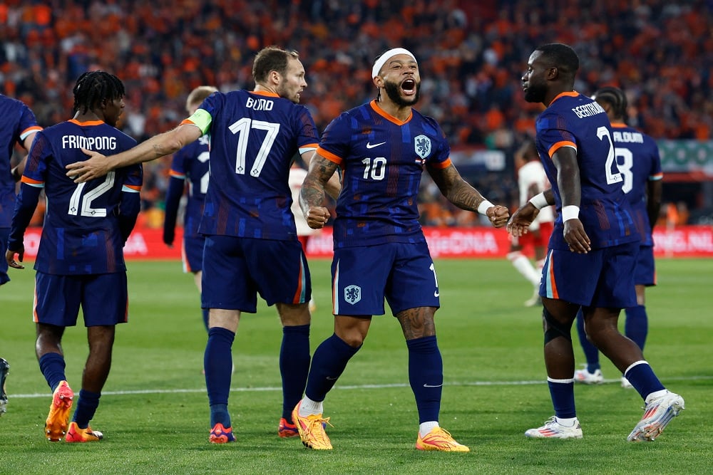 Pemain Timnas Belanda Memphis Depay merayakan gol ke gawang Kanada dalam uji coba jelang Piala Eropa 2024 (Euro 2024) / Reuters - Piroschka Van De Wouw.